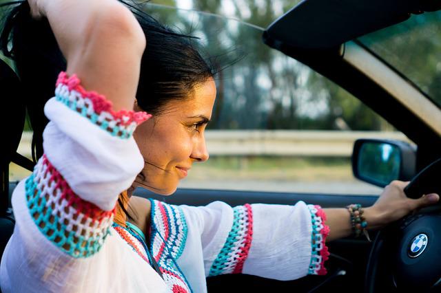 Women riding Convertible BMW